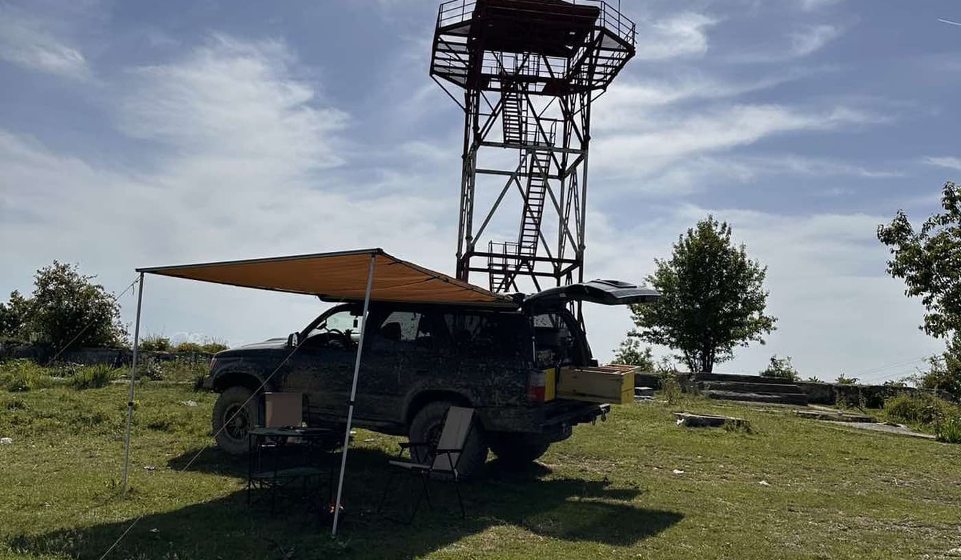 Overland vehicle at a hilltop in Kosovo